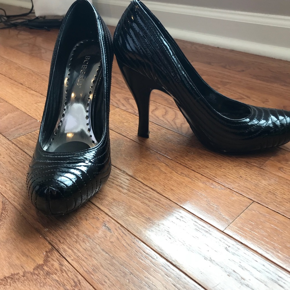 BCBGirls black patent pumps